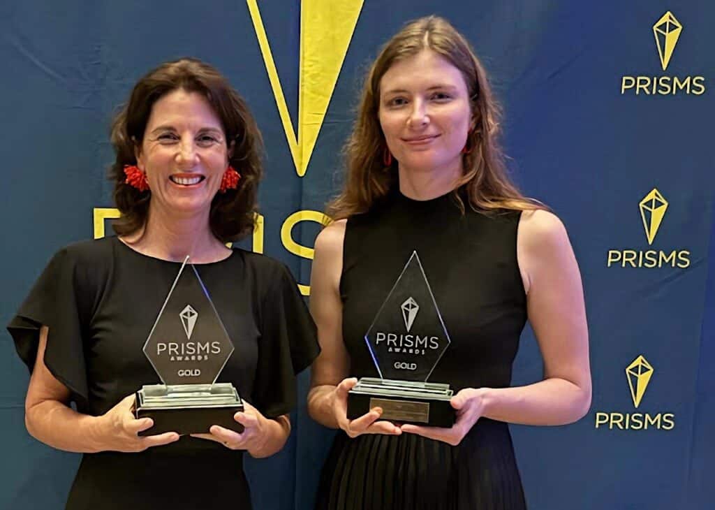 Ronelle Bester (left), founder of Red Ribbon Communications, alongside Ida-Marié Van der Merwe, senior account manager, receiving awards at the 2025 annual PRISM Awards ceremony.
